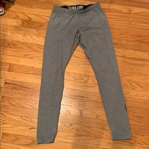 Grey Leggings with Nike Swoosh on back left leg